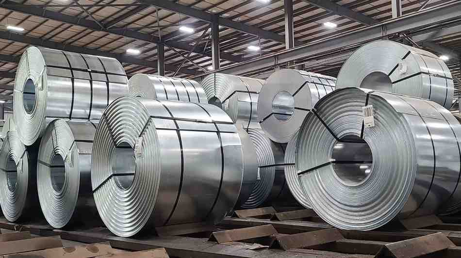 Many rolls of shiny, industrial galvanized steel.