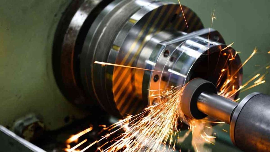 Grinding wheel creating sparks on a metal part.