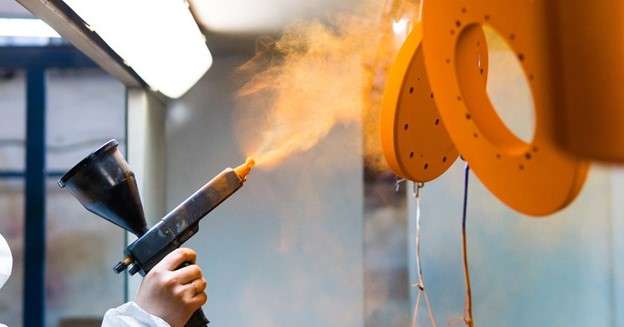 Performing powder coating finish with a spray gun for steel parts