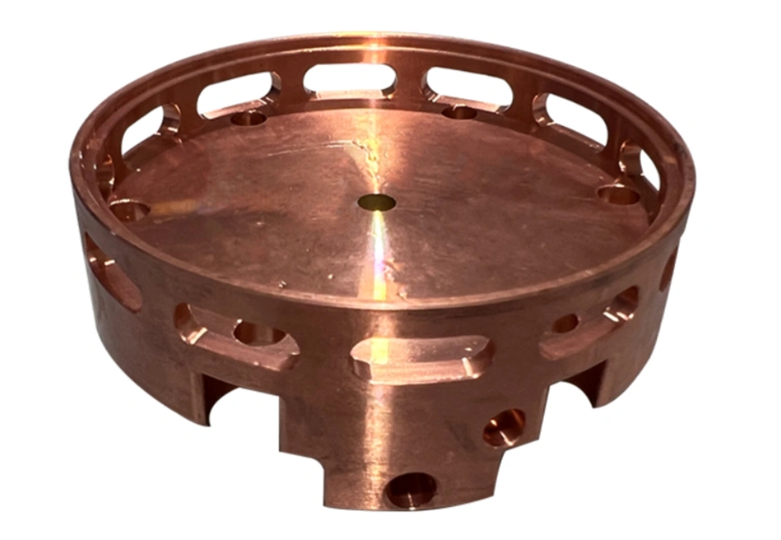 Image of a complex 4-axis CNC-machined copper component with intricate internal features and curved surfaces 