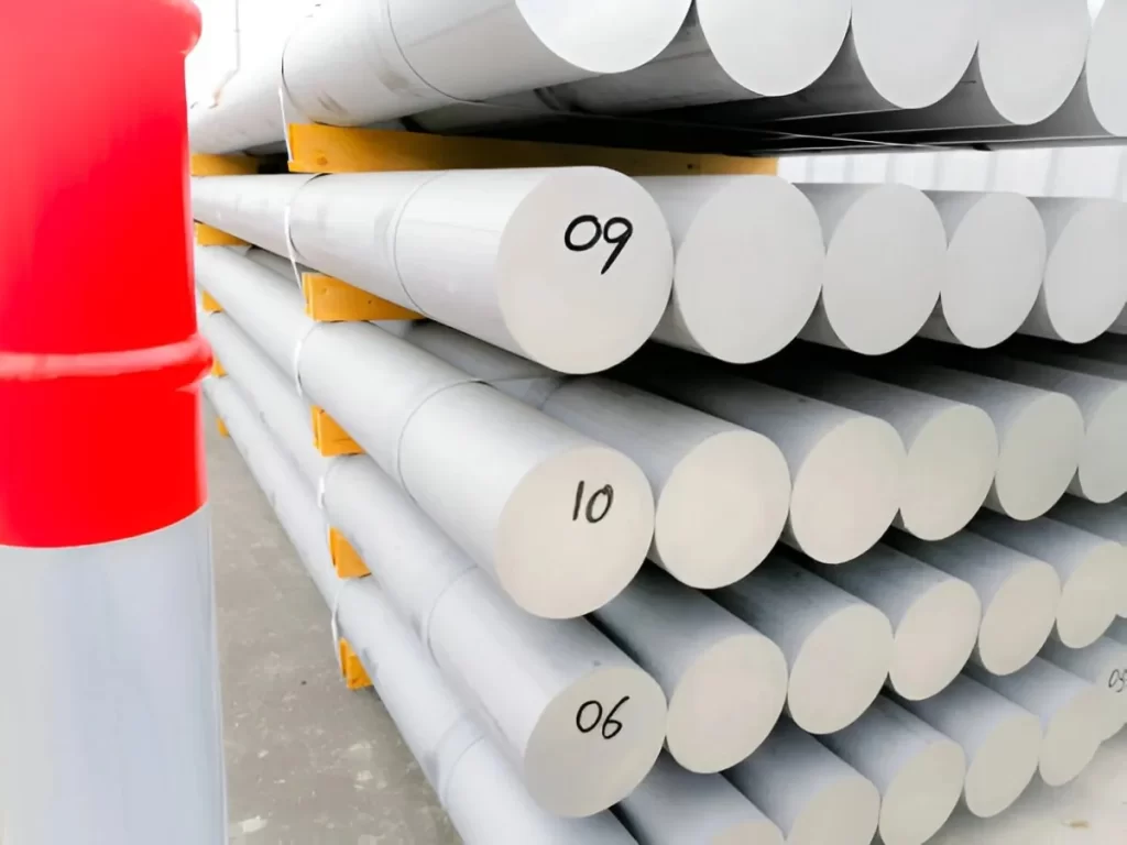 Stacked 7075 aluminum bar stock in inventory.