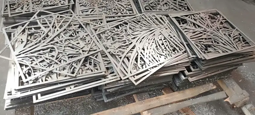 Stacked laser-cut sheet aluminum panels with decorative geometric patterns