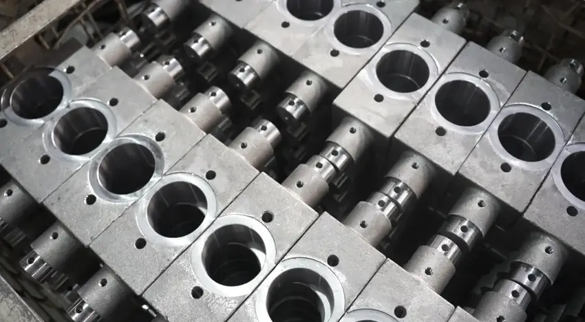 Precision-machined austenitic stainless steel industrial components displaying corrosion-resistant alloy