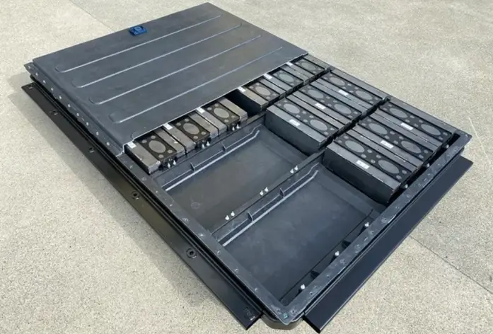 Sheet metal battery tray frame for an electric vehicle