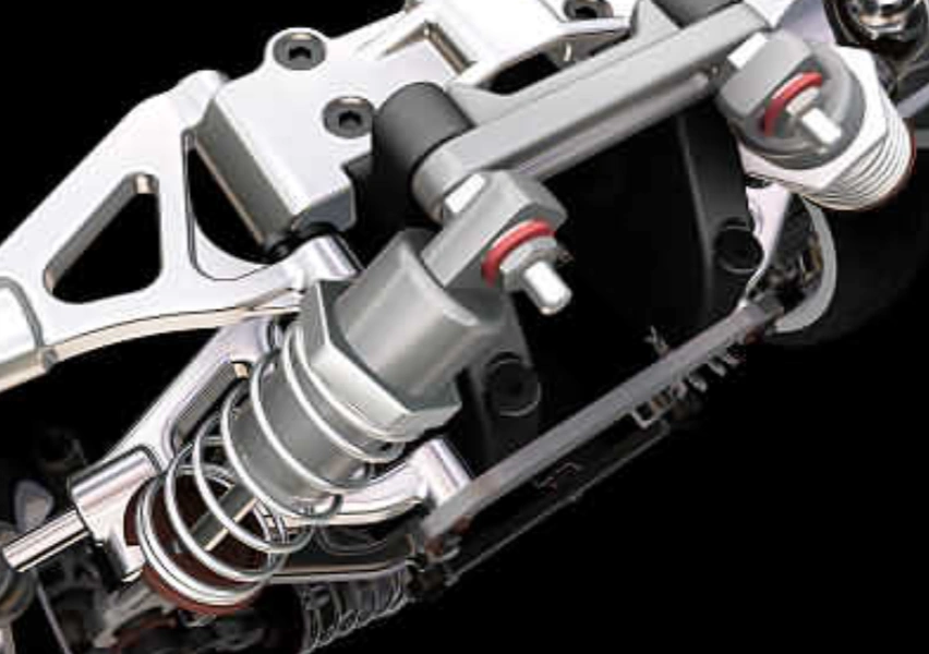 A closeup of two bolts used in the suspension arm of a BMW car