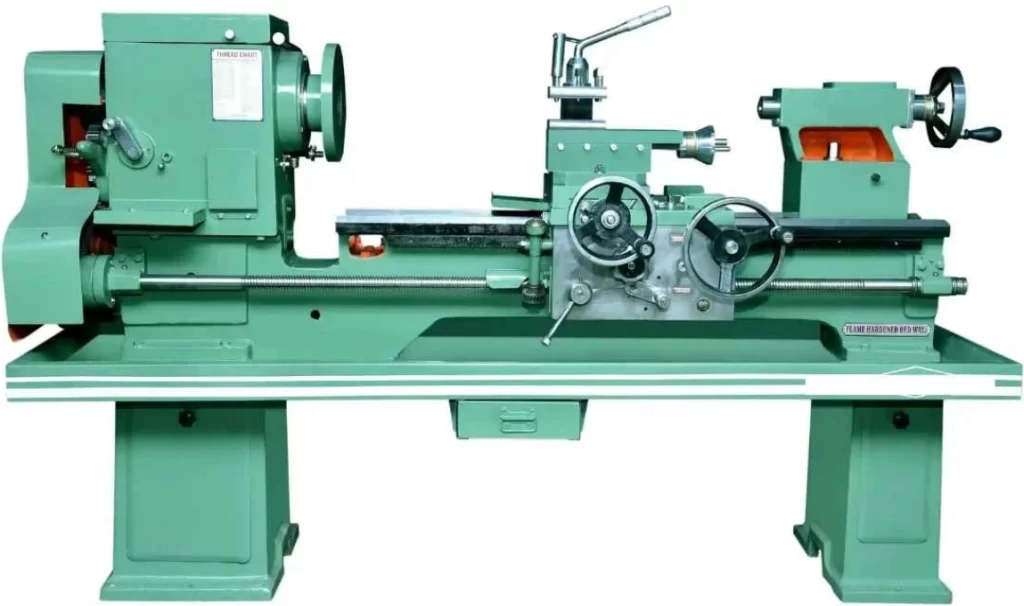 Green manual lathe machine mounted on a sturdy base 