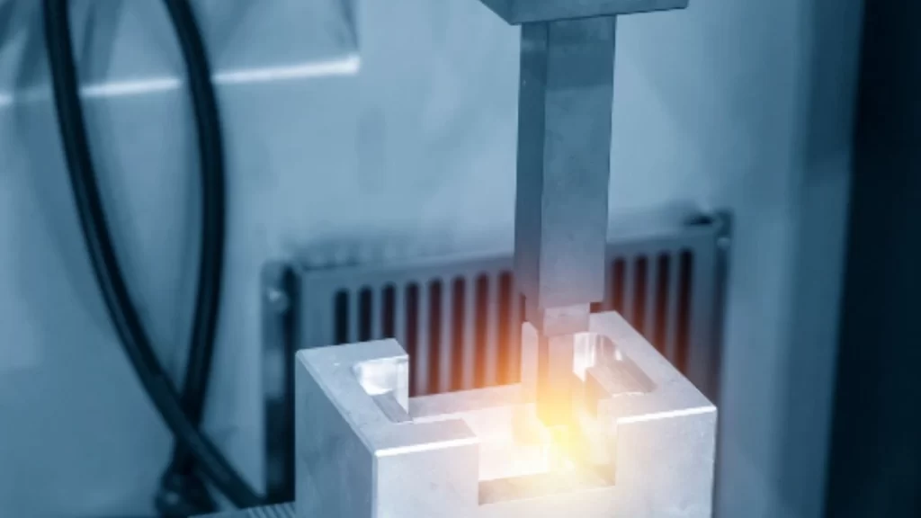 An image showing the EDM process of cutting an electronic enclosure. It has accurate slots and clean edges