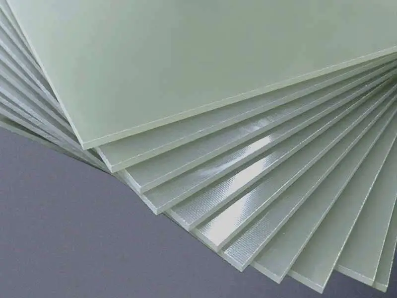 Stack of G10 FR4 fibreglass sheets used in machining applications.