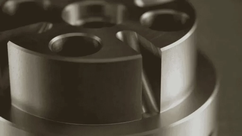 Display of a part with a hard-coated anodized finish. It is showing a durable and textured surface.