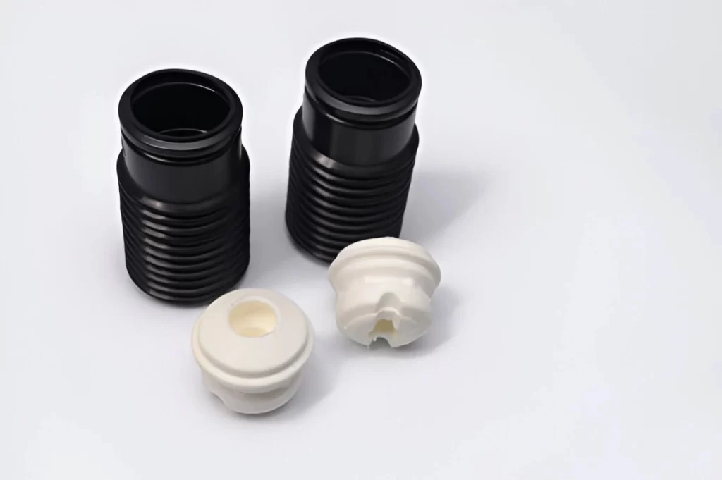 The image displays lightweight Delrin products in both white and black variants. 