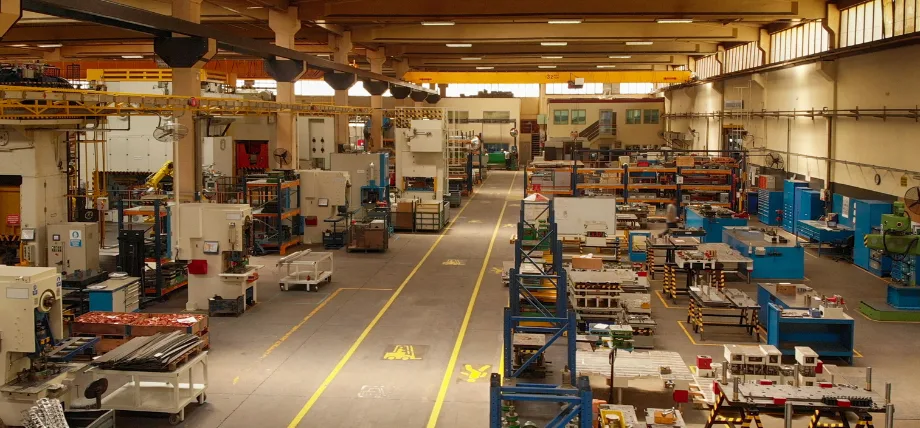 Photo of a metal machine shop with many workstations