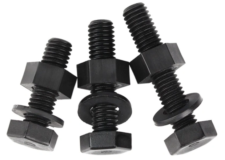 Three black nylon bolts of different sizes with nuts and washers on a white background