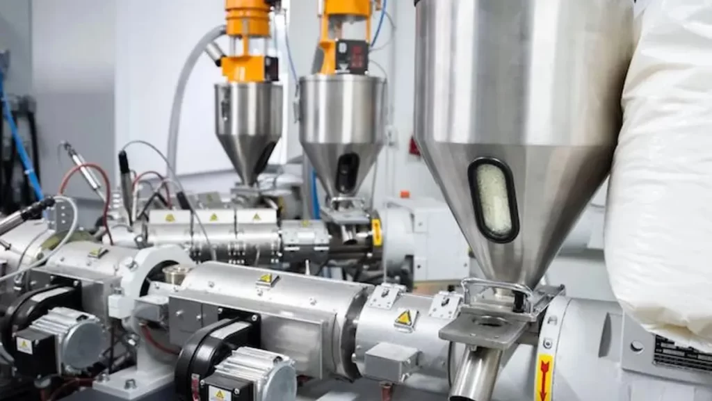 A detailed view of a plastic extrusion machine