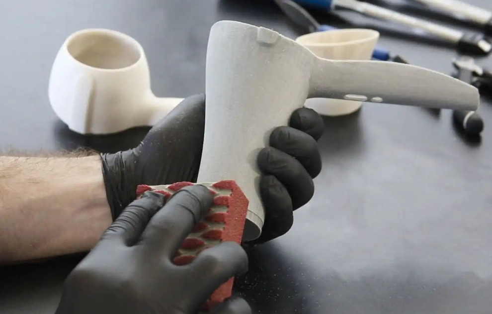 A close-up of a scrubbing exercise on SLA printed parts