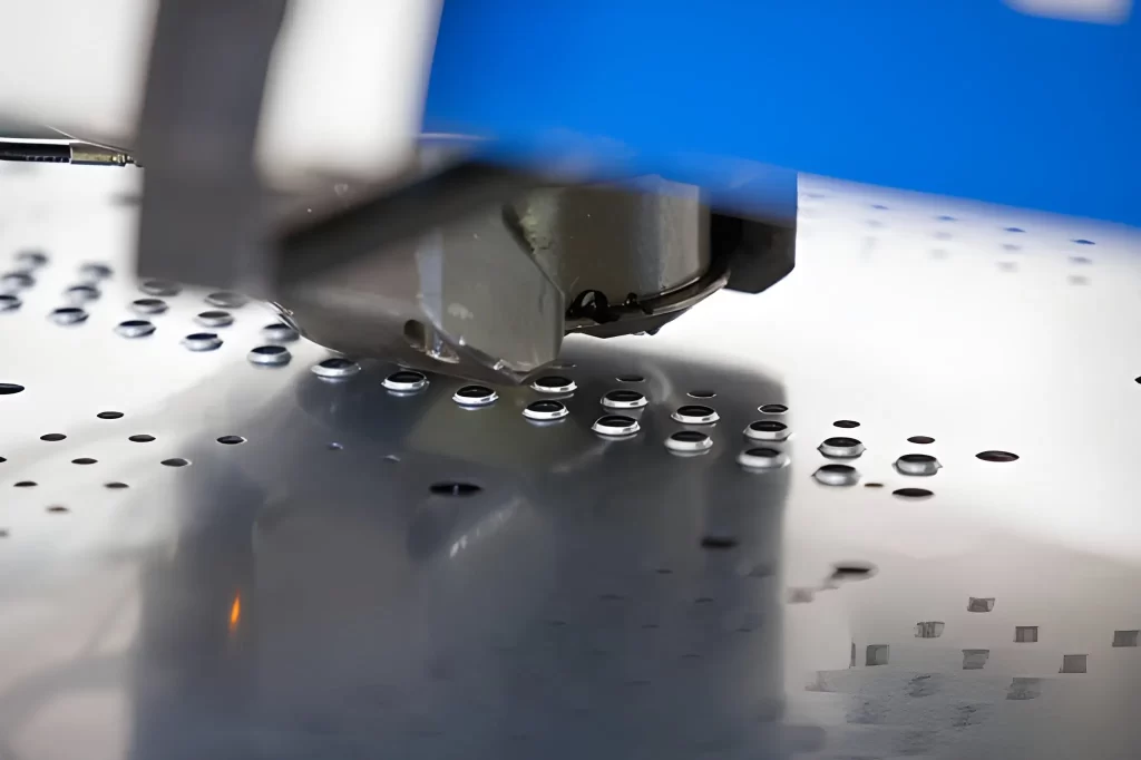 Sheet metal hole punching machine creates evenly spaced holes in a metal sheet.