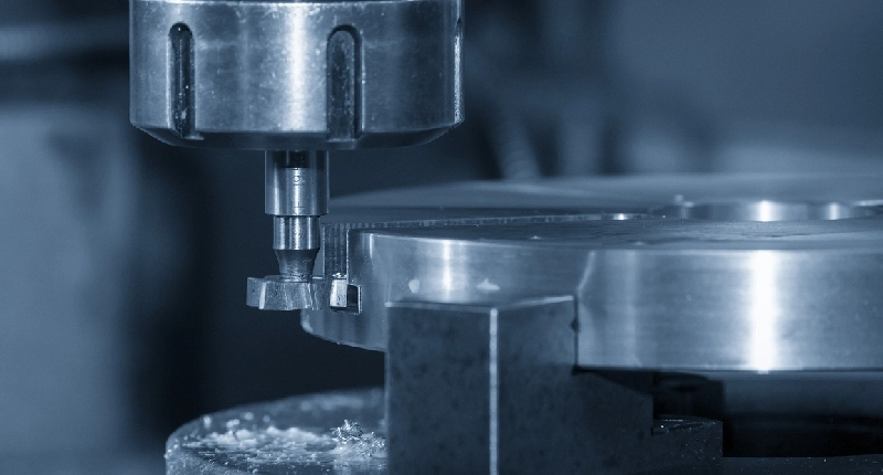CNC machine performing shoulder milling operation with a side and face cutter on a metal workpiece.