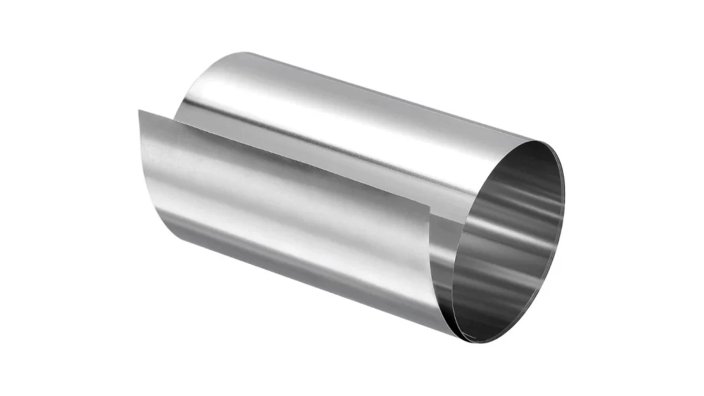 The image shows a large roll of stainless steel with a shiny, reflective surface.
