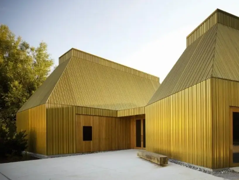 A house with bright yellow facade all over it 